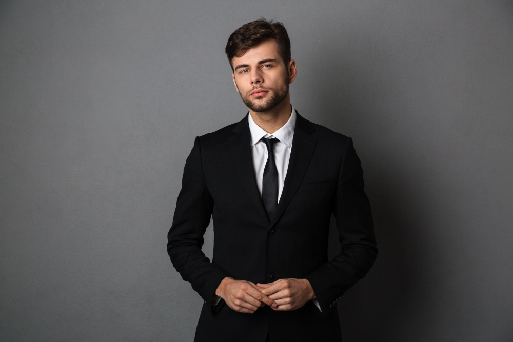 close-up-photo-of-young-successful-business-man-in-black-suit